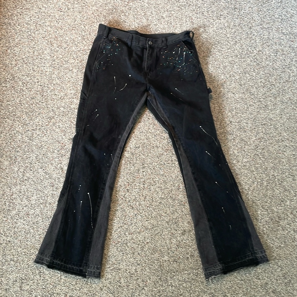 Flared Black icon distressed carpenter jeans, splatter paint design.
